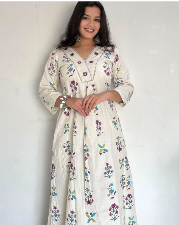 cotton kurta and pant set with intricate embroidery and vibrant prints, featuring a comfortable and stylish design perfect for casual and festive wear.