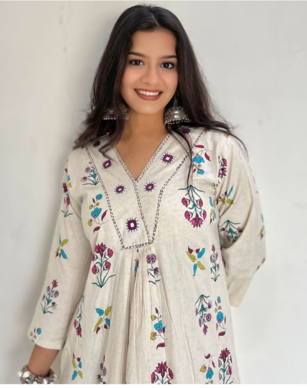 cotton kurta and pant set with intricate embroidery and vibrant prints, featuring a comfortable and stylish design perfect for casual and festive wear.