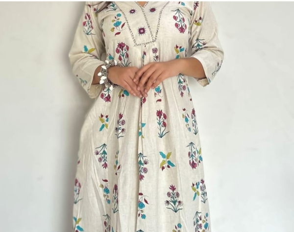 cotton kurta and pant set with intricate embroidery and vibrant prints, featuring a comfortable and stylish design perfect for casual and festive wear.