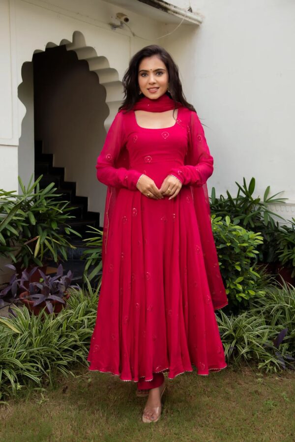 Elegant traditional Anarkali suit with intricate embroidery and flowing design, perfect for festive or formal occasions
