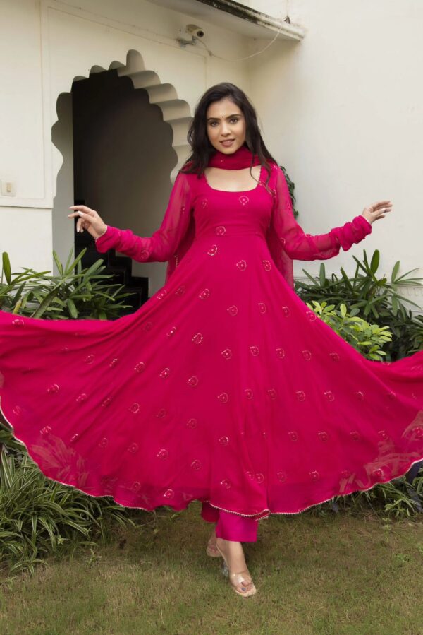 Elegant traditional Anarkali suit with intricate embroidery and flowing design, perfect for festive or formal occasions
