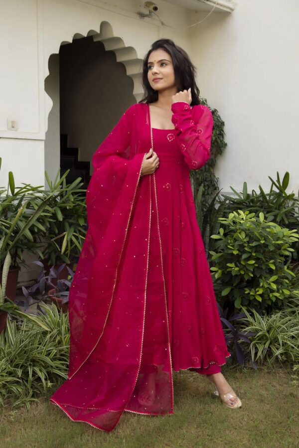 Elegant traditional Anarkali suit with intricate embroidery and flowing design, perfect for festive or formal occasions