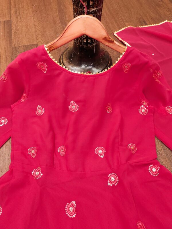 Elegant traditional Anarkali suit with intricate embroidery and flowing design, perfect for festive or formal occasions