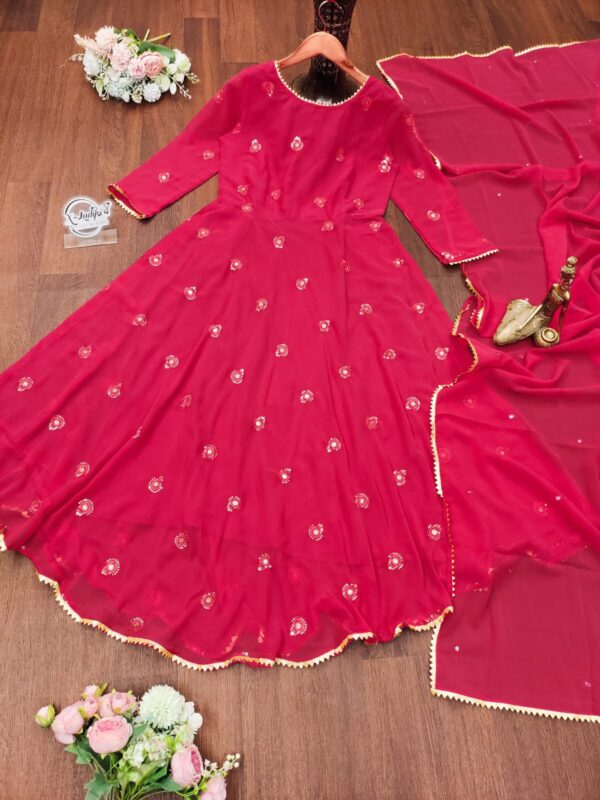 Elegant traditional Anarkali suit with intricate embroidery and flowing design, perfect for festive or formal occasions